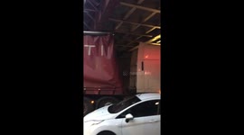 Truck stuck under the bridge in Brixton (UK)