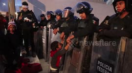 US border patrol agent plays with Honduran child at Tijuana border