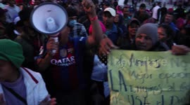 Large group of Honduran Migrants protesting at the US-Mexico border