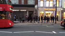 Shoppers queuing on Oxford Street for shoe sales during Black Friday