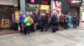 London's Oxford Street looks deserted as just a handful of senior citizens queue outside HMV