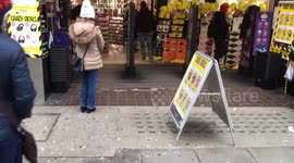 London's Oxford Street looks deserted as just a few senior citizens queue outside HMV