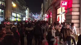 Crowds of late-night Black Friday shoppers swarm Oxford Street
