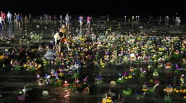 Loy Kratong delta of candles where river meets the sea