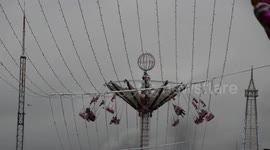 Christmas market of the Champs-Elysees: (Fumes of fire and Police helicopter in background due to the riots with the