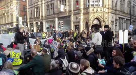 Climate change protest blocks street in Manchester's Deansgate