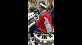 Elton John impersonator entertains London shoppers with street performance