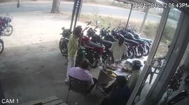 Horrific CCTV footage shows an out-of-control bus mowing down a dozen of motorcycles and people sitting in the motorcycle showroom in India