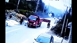 Family on scooter taken out by back door on lorry trailer