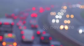 Time lapse of traffic commuting in rush hour fog in Leeds