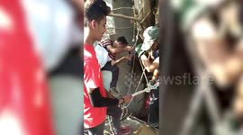 Cat lovers climb 40-ft down a well to rescue a trapped feline