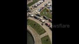Horrific video of two men walking on a tightrope above a crowd