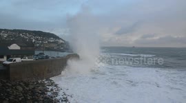 Huge Storm Diana waves surge over Mousehole Harbour wall in Cornwall