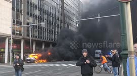 Police vehicles in flames amid clashes with 'yellow jacket' protesters in Brussels