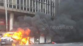 Police vehicles in flames amid clashes with 'yellow jacket' protesters in Brussels