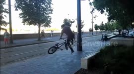 Tram runs over bike in BMX stunt gone wrong