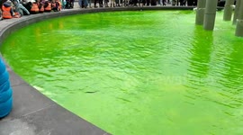 Fountain in Brussels dyed green for Climate March