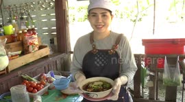 Thai people eating live crabs with salad