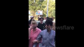 Sophie Turner hide her face as she and fiancé Joe Jonas fly out of Jodhpur after Nick and Priyanka Chopra's three-day wedding