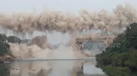 Dramatic footage shows 100-year-old bridge being brought down in India