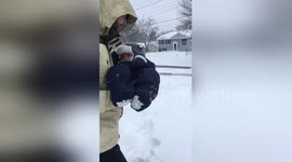 Father dunks baby son into fresh snow in viral video