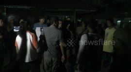 Angry Indonesian landlord tries to ram police with his car after they evict illegal tenants