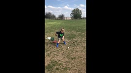 Little boy working on his golf swing fail