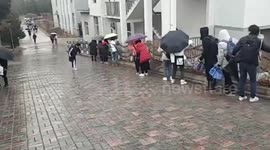 Chinese university students slip on icy ramp road following rainfalls