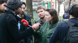 A rioter slams the head of a security agent of the French Railroad Society Transports (SNCF) as an illegal protest against the rise of the scholarship price for the foreign students.