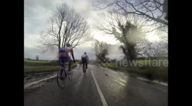 Car splashes cyclist in flooded road