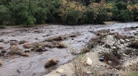 Footage shows fast-moving mud and debris flow as heavy rains strike Holy Fire burn area