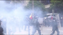 Riot police fire tear gas at protesting students in Colombia