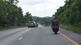 Policeman teams up with civilian on motorbike in high-speed chase