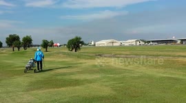 Planes Land Next To Golf Course