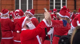 Thousands of revelers turn out for SantaCon in London