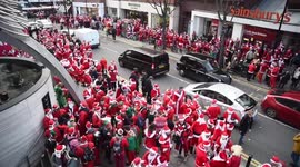 Thousands of Santas take over London in worldwide Christmas parade