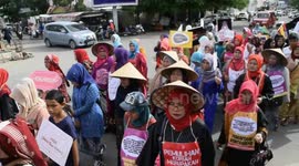 Indonesian demonstrators take to the streets to protest violence against women