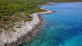 Flying over blue sea on island Hvar, Croatia