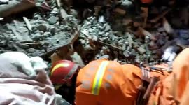 Three houses buried and four killed in massive Chinese landslide