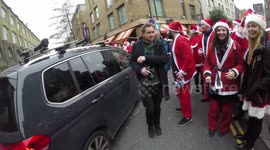 Santa Jumps Onto The Back Of A Car