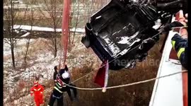 Firefighters rescue driver trapped in semi-trailer hanging off snowy motorway