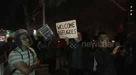 Activists stage rally in downtown LA to support asylum seekers on International Human Rights Day