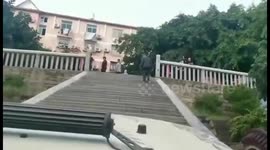 Lazy man drives his SUV up 49 steps to Chinese temple