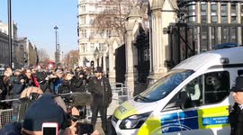 Police van leaves Parliament with a man arrested earlier