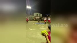 Basketball referee does cartwheels and splits when a player scores