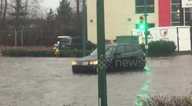 Cars stranded on flooded streets after heavy downpour inundates Metro Vancouver