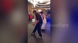 Bride and dad wow wedding guests with dance on roller skates
