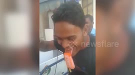 Hilarious footage shows man struggling to remove ice-cream stuck on his tongue