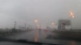 Driving in a heavy rain storm.