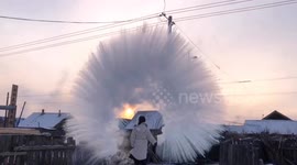 Woman makes amazing ice halo in the air with boiling water